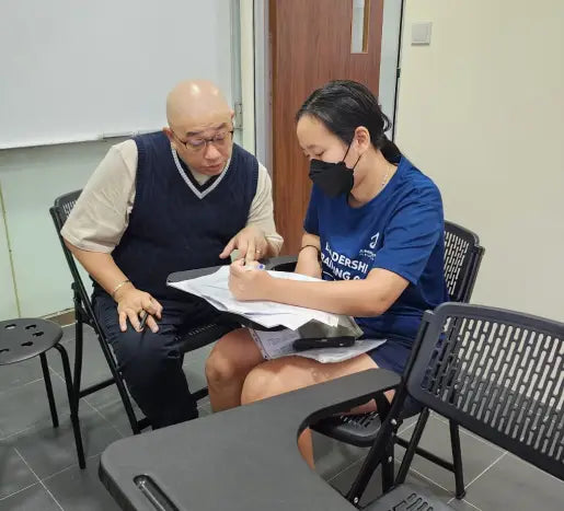Tutor Lim Daw Shyan in a one-on-one tuition session with a student